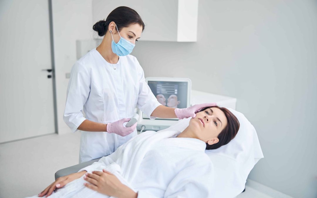 Dermatologist examining patient's skin